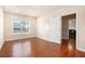 Bedroom with wood floors, bright window view, and neutral paint at 2435 Portsmouth Ct, Marietta, GA 30064