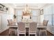 Formal dining room with hardwood floors, wainscoting, and elegant chandelier at 2435 Portsmouth Ct, Marietta, GA 30064