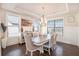 Elegant dining room with wainscoting, a coffered ceiling, chandelier, and large windows for natural light at 2435 Portsmouth Ct, Marietta, GA 30064