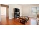 Living room featuring hardwood floors and an entertainment center at 2435 Portsmouth Ct, Marietta, GA 30064