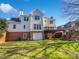 Exterior of the home with a deck, garage, and expansive backyard at 2925 Chesterfield Se Way, Conyers, GA 30013