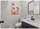 This half bathroom features updated fixtures, a statement mirror, and modern black and white accents at 4035 Chelsea Cmn, Tucker, GA 30084