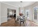 Charming dining room with a view of the living room, ready for entertaining at 4035 Chelsea Cmn, Tucker, GA 30084