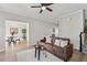 Spacious living room flows into the dining area, featuring hardwood floors and natural light at 4035 Chelsea Cmn, Tucker, GA 30084