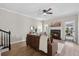 Cozy living room featuring a fireplace, natural light, and hardwood flooring at 4035 Chelsea Cmn, Tucker, GA 30084