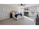 The main bedroom features a ceiling fan and fireplace, with ample natural light at 4035 Chelsea Cmn, Tucker, GA 30084