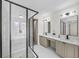 Modern bathroom with a glass-enclosed shower, double sinks, and a vanity area at 724 Eastwood Rise, Stone Mountain, GA 30087