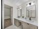 Modern bathroom with dual sinks and a walk-in closet at 724 Eastwood Rise, Stone Mountain, GA 30087