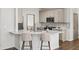 Kitchen with white countertops, a peninsula island with seating, and stainless steel appliances at 724 Eastwood Rise, Stone Mountain, GA 30087