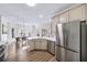 Bright kitchen with stainless steel appliances, white countertops, and wood floors at 724 Eastwood Rise, Stone Mountain, GA 30087