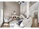 Grand living room featuring a fireplace, high ceilings, paneled wall, staircase, and modern decor at 724 Eastwood Rise, Stone Mountain, GA 30087