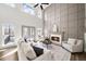 Bright living room featuring a fireplace, tall windows, and a decorative accent wall at 724 Eastwood Rise, Stone Mountain, GA 30087