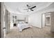 Spacious main bedroom with tray ceilings, a ceiling fan, and neutral-colored walls at 724 Eastwood Rise, Stone Mountain, GA 30087