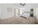 Bright main bedroom featuring carpet, a trey ceiling, and ensuite access at 724 Eastwood Rise, Stone Mountain, GA 30087