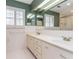 Bathroom with vanity, double sinks, white cabinets and plantation shutters at 870 Richmond Hill Dr, Marietta, GA 30068