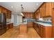 Traditional kitchen with wood cabinets, stainless steel appliances, and center island with pendant lights at 870 Richmond Hill Dr, Marietta, GA 30068