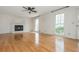 Bright living room with hardwood floors, fireplace, and large windows offering natural light at 870 Richmond Hill Dr, Marietta, GA 30068