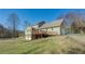 Spacious backyard featuring a deck and a partially fenced yard at 1103 Wallington Nw Ct, Conyers, GA 30012