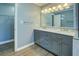 A double vanity and soft blue paint give this bathroom a clean and updated look at 1103 Wallington Nw Ct, Conyers, GA 30012