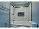 Bathroom featuring a bathtub and ceramic tiled walls at 1103 Wallington Nw Ct, Conyers, GA 30012