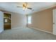 Bedroom features plush carpeting, a ceiling fan and neutral walls at 1103 Wallington Nw Ct, Conyers, GA 30012