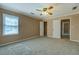 Carpeted bedroom with closet and ensuite bathroom at 1103 Wallington Nw Ct, Conyers, GA 30012