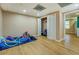 Cozy bedroom featuring wood floors and closet with bedroom leading to kitchenette at 1103 Wallington Nw Ct, Conyers, GA 30012