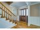Entryway with hardwood floors, grand front door, and stairs leading to the upper level at 1103 Wallington Nw Ct, Conyers, GA 30012