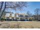 Inviting two-story home with metal roof and a picturesque front yard at 1103 Wallington Nw Ct, Conyers, GA 30012