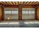 Two-car garage with carpet floor and single pane windows in doors at 1103 Wallington Nw Ct, Conyers, GA 30012