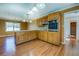 Functional kitchen with an island and wooden cabinetry at 1103 Wallington Nw Ct, Conyers, GA 30012