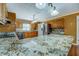 Spacious kitchen boasts granite countertops, a large island, stainless steel appliances, and ample storage at 1103 Wallington Nw Ct, Conyers, GA 30012