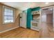 The kitchenette features modern appliances, laminate flooring, and plenty of natural light at 1103 Wallington Nw Ct, Conyers, GA 30012