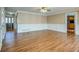 This spacious living room has wood-look floors and white wainscoting, perfect for entertaining at 1103 Wallington Nw Ct, Conyers, GA 30012