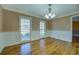 Bright room with hardwood floors and wide windows, offering an airy and inviting space at 1103 Wallington Nw Ct, Conyers, GA 30012