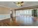 Open concept living room featuring hardwood floors, fireplace, and lots of natural light at 1103 Wallington Nw Ct, Conyers, GA 30012