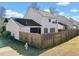 A full fenced backyard with a screened-in porch and well-maintained lawn is a great place to spend time at 113 Plumeria St, Canton, GA 30114