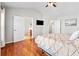 Bedroom featuring hardwood floors and ensuite bathroom access at 113 Plumeria St, Canton, GA 30114