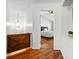 Hallway view into bedroom featuring hardwood floors and ceiling fan at 113 Plumeria St, Canton, GA 30114