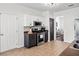 Kitchen features stainless steel appliances, dark cabinets, and tile backsplash at 113 Plumeria St, Canton, GA 30114