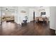 Open-concept living and dining area with hardwood floors and abundant natural light at 113 Plumeria St, Canton, GA 30114
