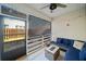 Covered screened patio with outdoor seating and view of the backyard at 113 Plumeria St, Canton, GA 30114