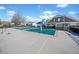 Community pool with lounge chairs, a covered area, and a large pool area covered for the off-season at 113 Plumeria St, Canton, GA 30114