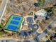 Aerial view of neighborhood amenities including a pool, clubhouse, playground, and tennis courts at 617 Oakbourne Way, Woodstock, GA 30188