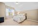 Inviting bedroom featuring white linens, plush carpet, and lots of light at 617 Oakbourne Way, Woodstock, GA 30188