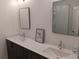 Modern bathroom with double sinks, quartz countertop, and glass-enclosed shower at 732 Fond Ln, Atlanta, GA 30315