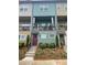 Charming townhome with colorful facade, covered balcony, and well-maintained front yard at 732 Fond Ln, Atlanta, GA 30315