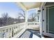 Balcony with white railings overlooking a leafy neighborhood on a sunny day at 970 Drewry Ne St, Atlanta, GA 30306
