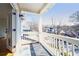 Balcony featuring white railings, slate floor, and view of the neighborhood at 970 Drewry Ne St, Atlanta, GA 30306