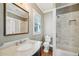 Elegant bathroom featuring marble countertops, subway tile shower and framed mirror at 970 Drewry Ne St, Atlanta, GA 30306